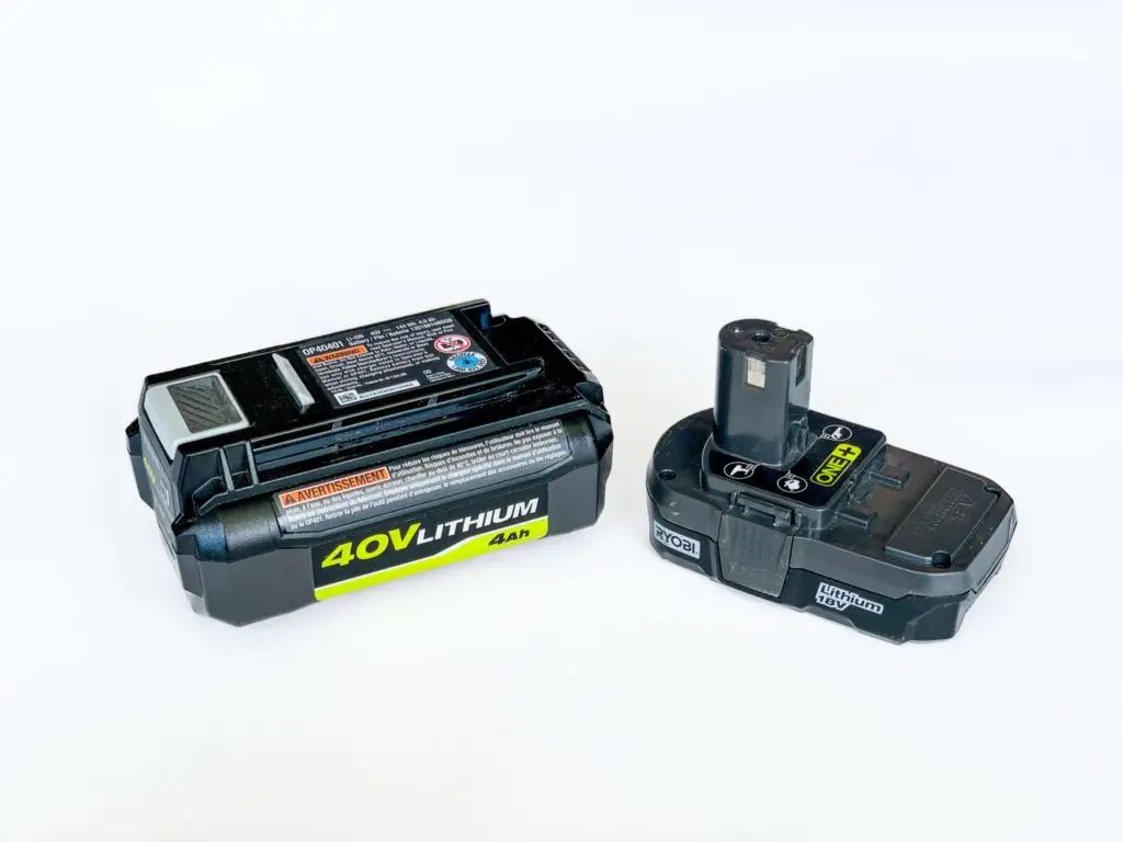 Two rechargeable lithium-ion batteries of different sizes on a white background, likely used for powering cordless tools or electronic devices.