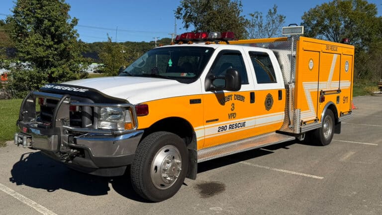 West Deer VFD 290 rescue truck, white and yellow with emergency lights and markings.